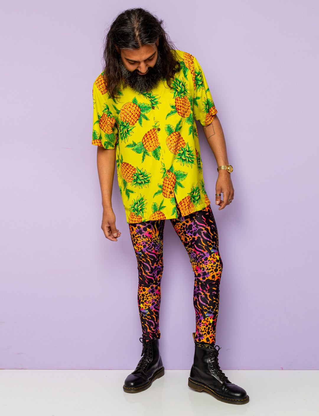 Man modelling a pair of purple leopard print Mens leggings.