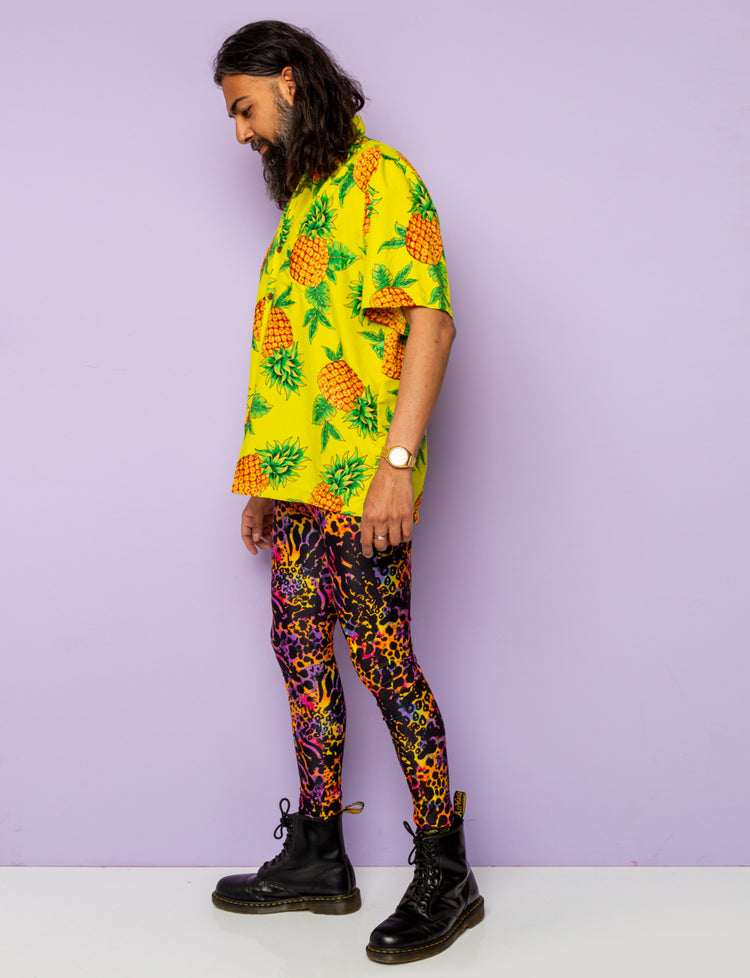 Man modelling a pair of purple leopard print Mens leggings.