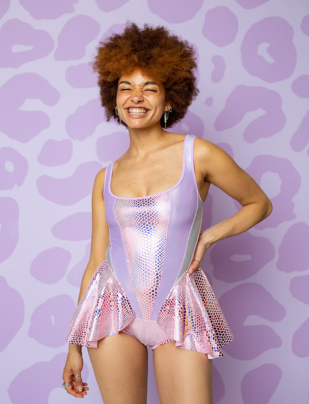 woman wearing bodysuit with peplum in pink and lilac shiny fabric 