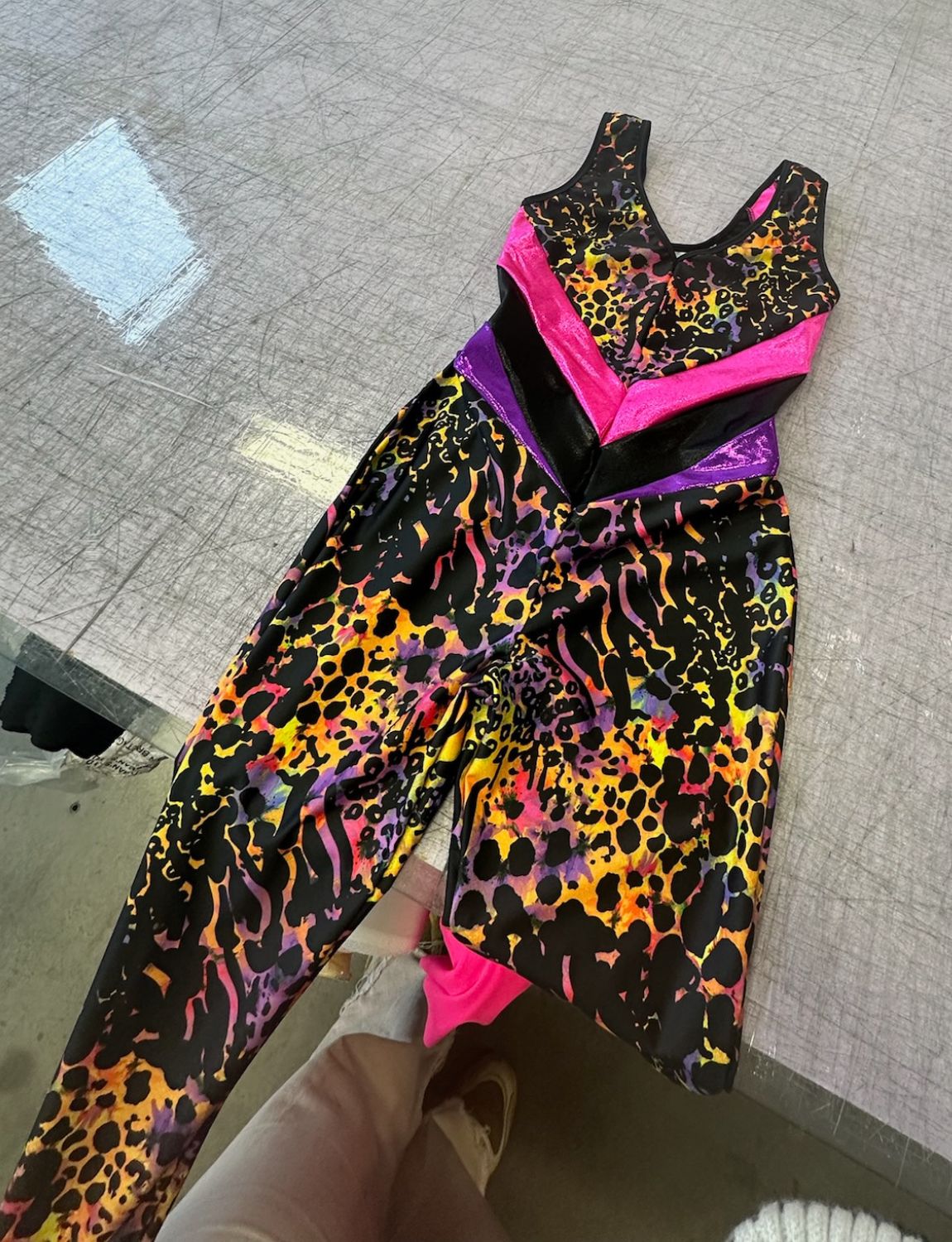 Colourful animal print lycra catsuit.