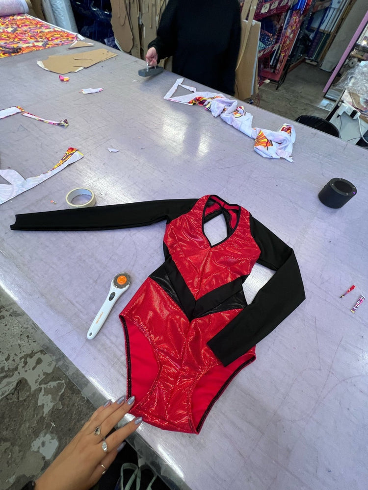 red lycra leotard with black sleeves