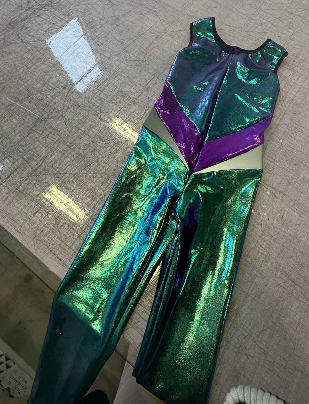 Kids lycra catsuit in metallic green and purple.