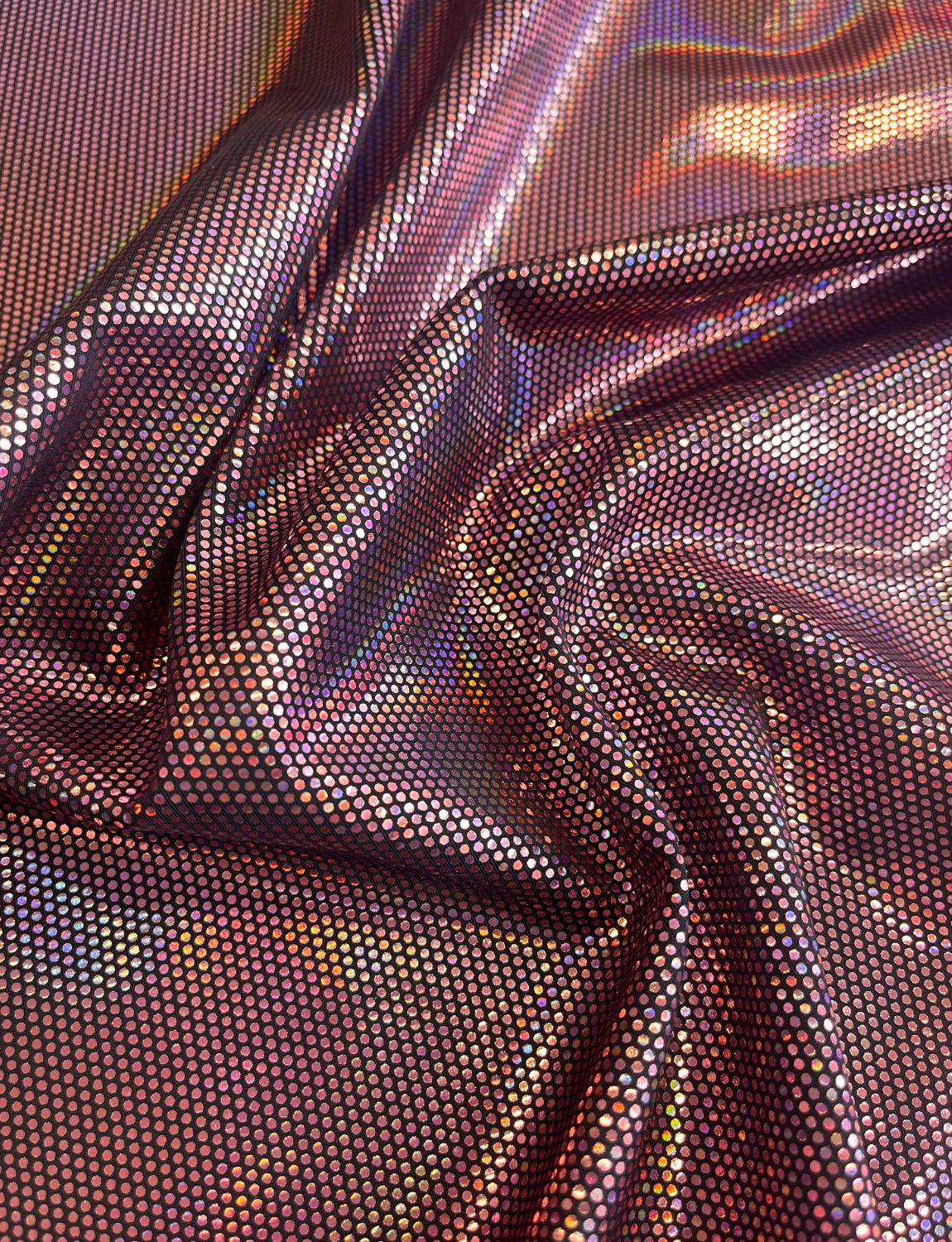 Pink holographic spotted foil on black stretch fabric.