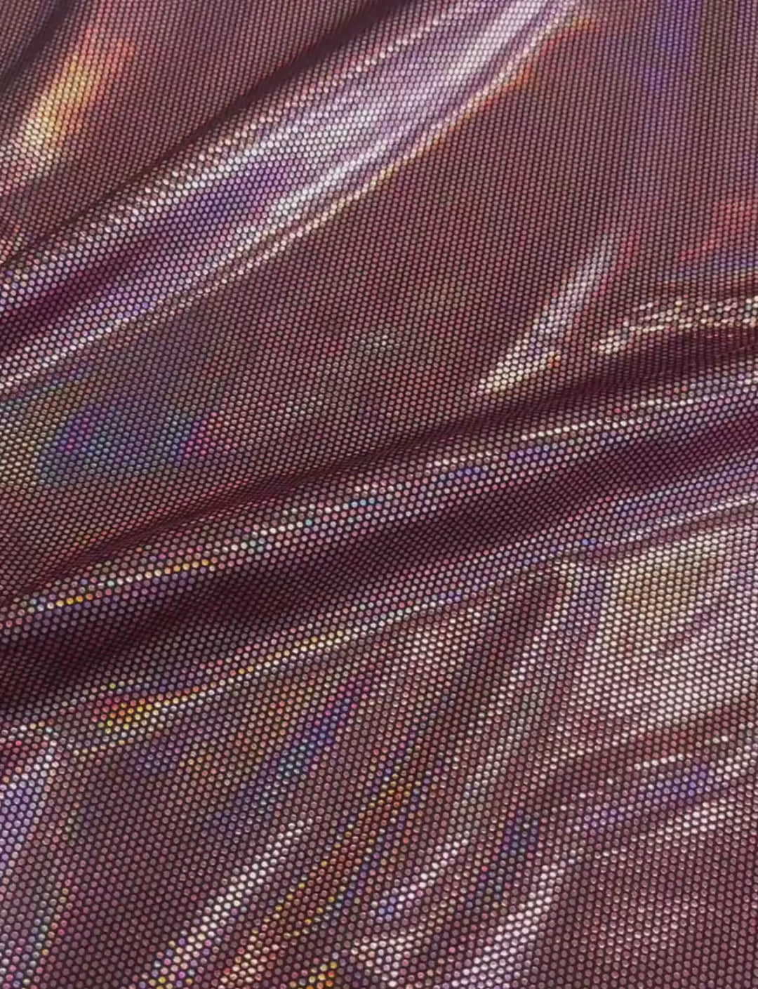 Pink spotted foil spandex fabric.