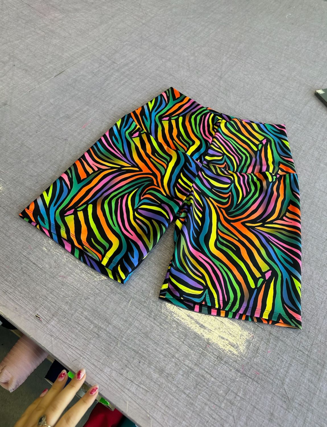 Rainbow zebra print lycra cycling shorts.