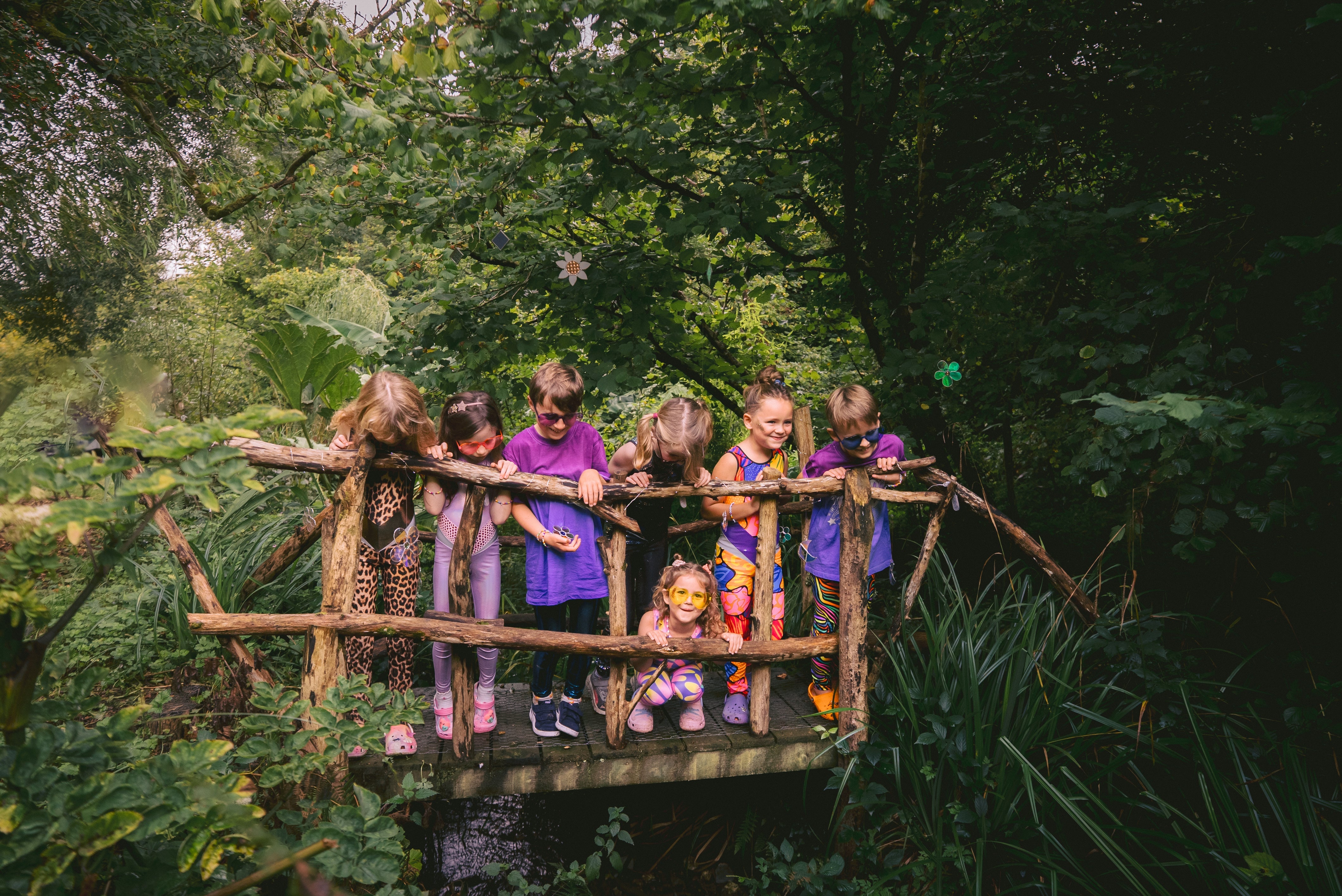 kids wearing festival wear in a forest