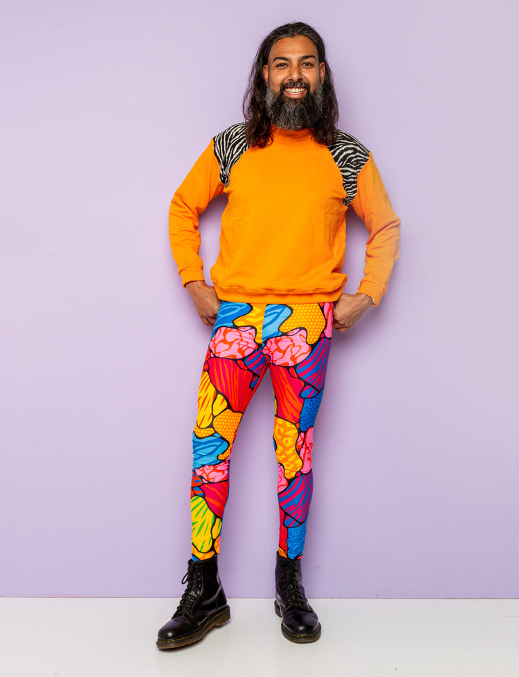 Guy modelling multi coloured animal print mens leggings