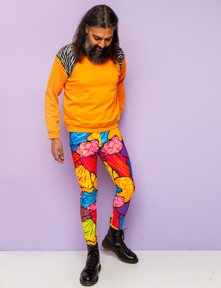 Guy modelling multi coloured animal print mens leggings