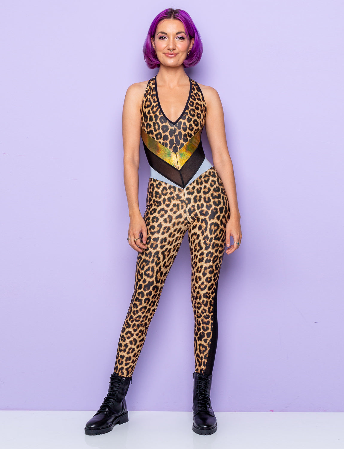 woman wearing backless leopard print catsuit