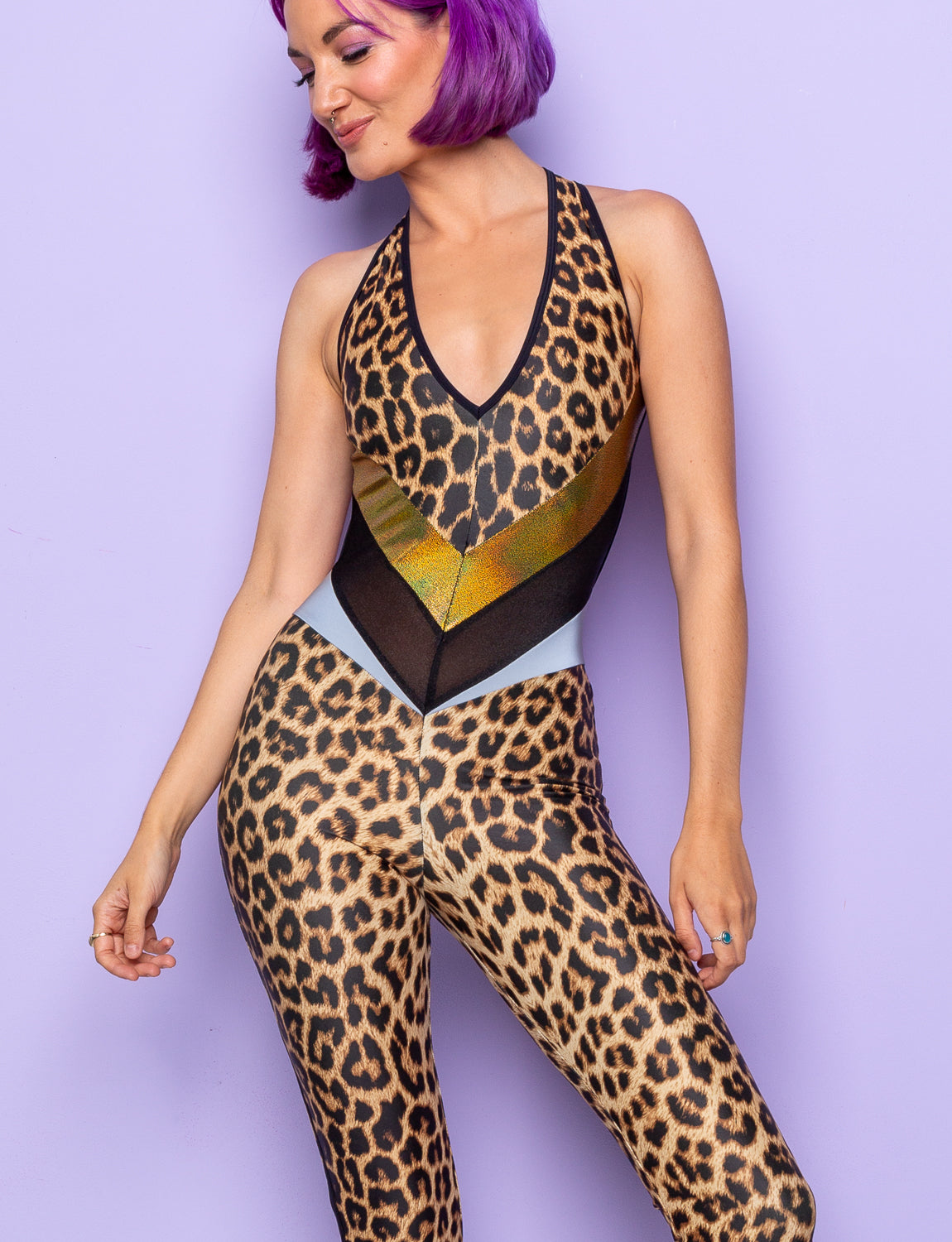 woman wearing backless leopard print catsuit