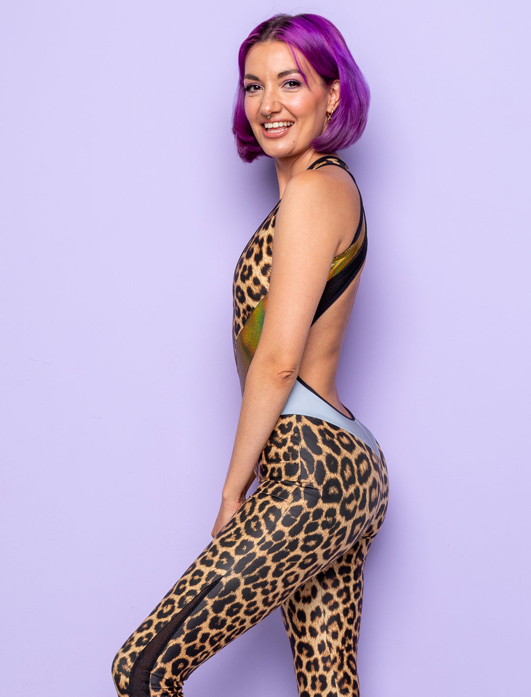 woman wearing backless leopard print catsuit