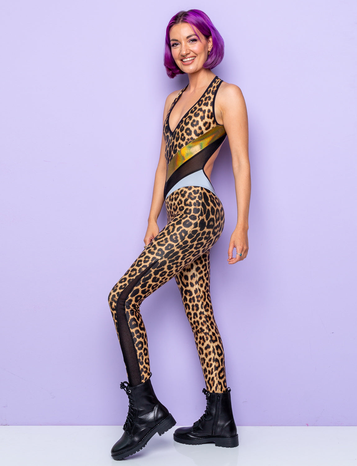 woman wearing backless leopard print catsuit