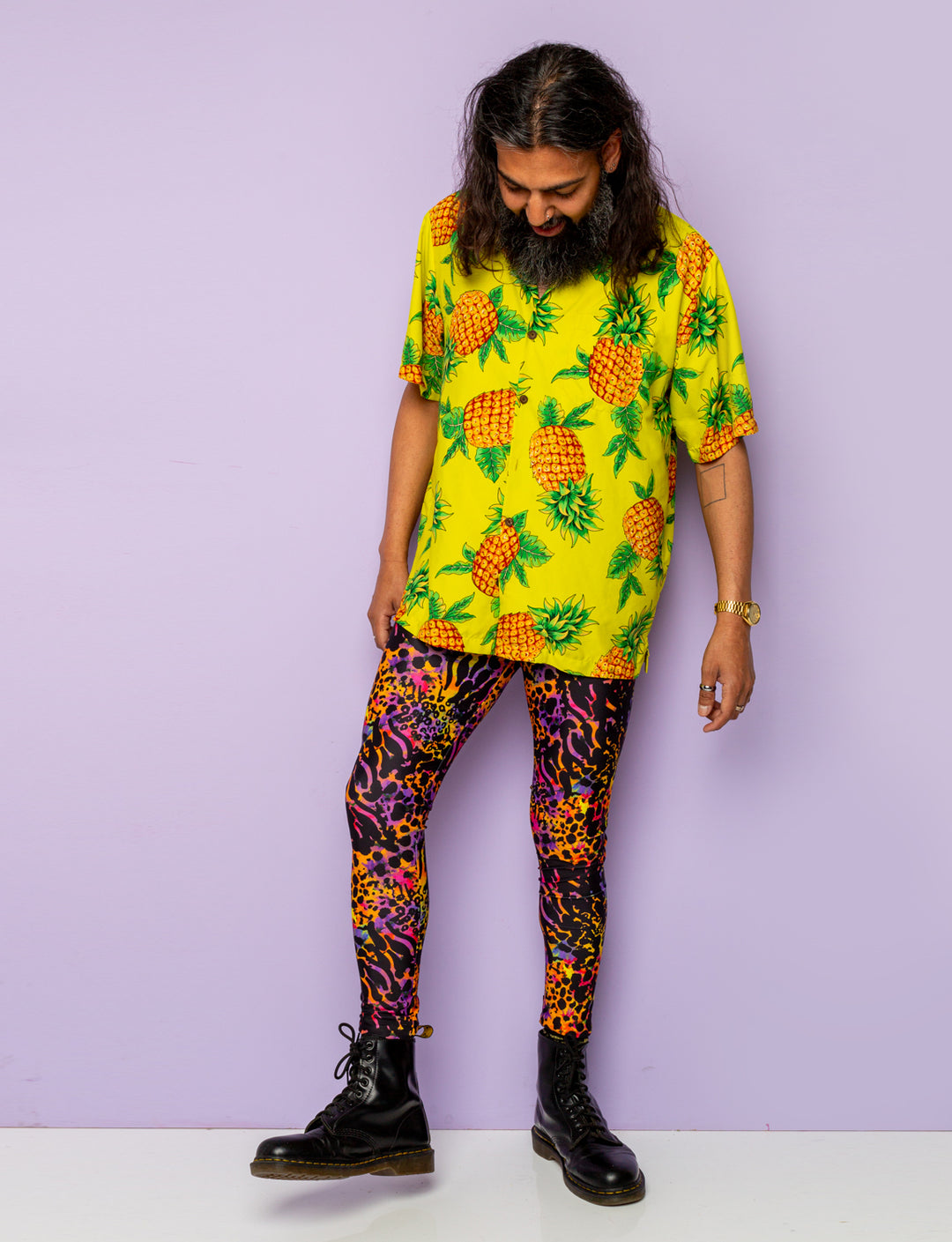 Man modelling a pair of purple leopard print Mens leggings.