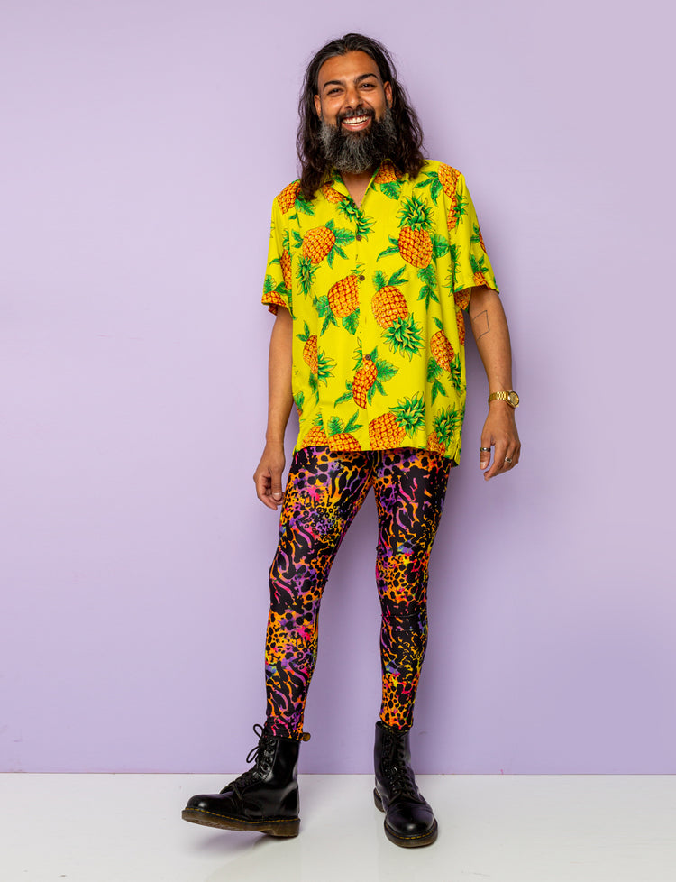 Man modelling a pair of purple leopard print Mens leggings.