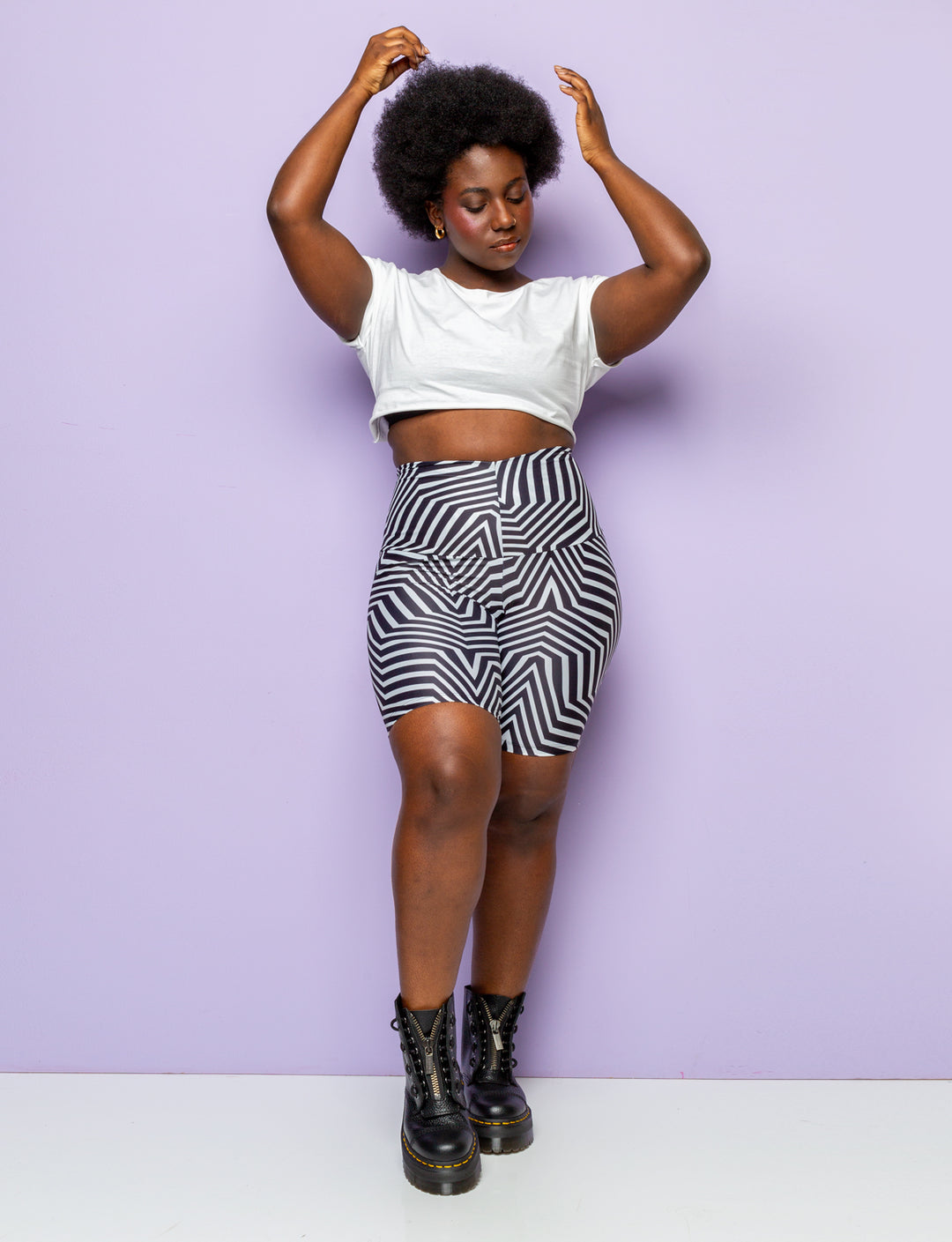 Woman wearing funky black and white patterned lycra cycling shorts.