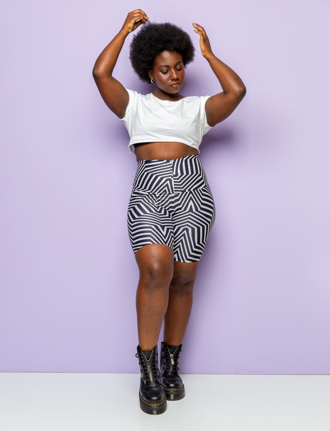 Woman wearing funky black and white patterned lycra cycling shorts.