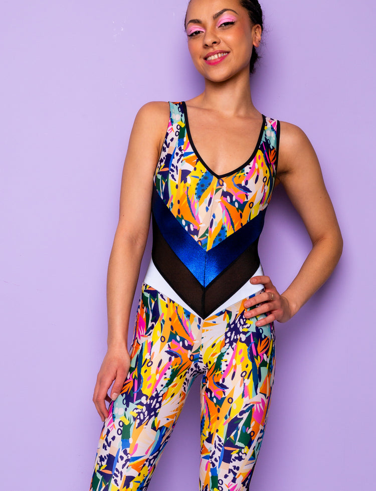 Woman modelling a jungle print lycra catsuit with contrasting waist panels.