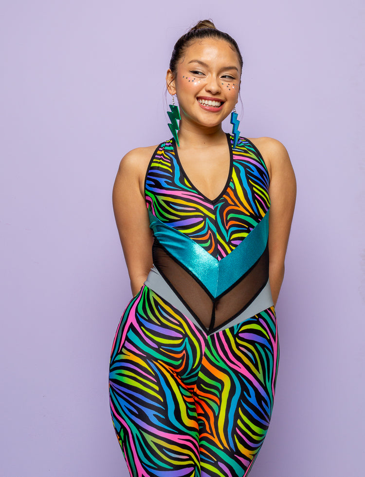 Woman modelling a multi coloured zebra print catsuit.