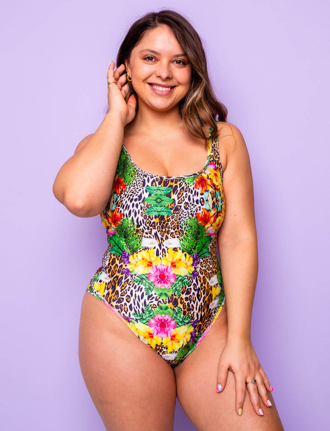 Woman wearing a tropical leopard print lycra swimsuit.