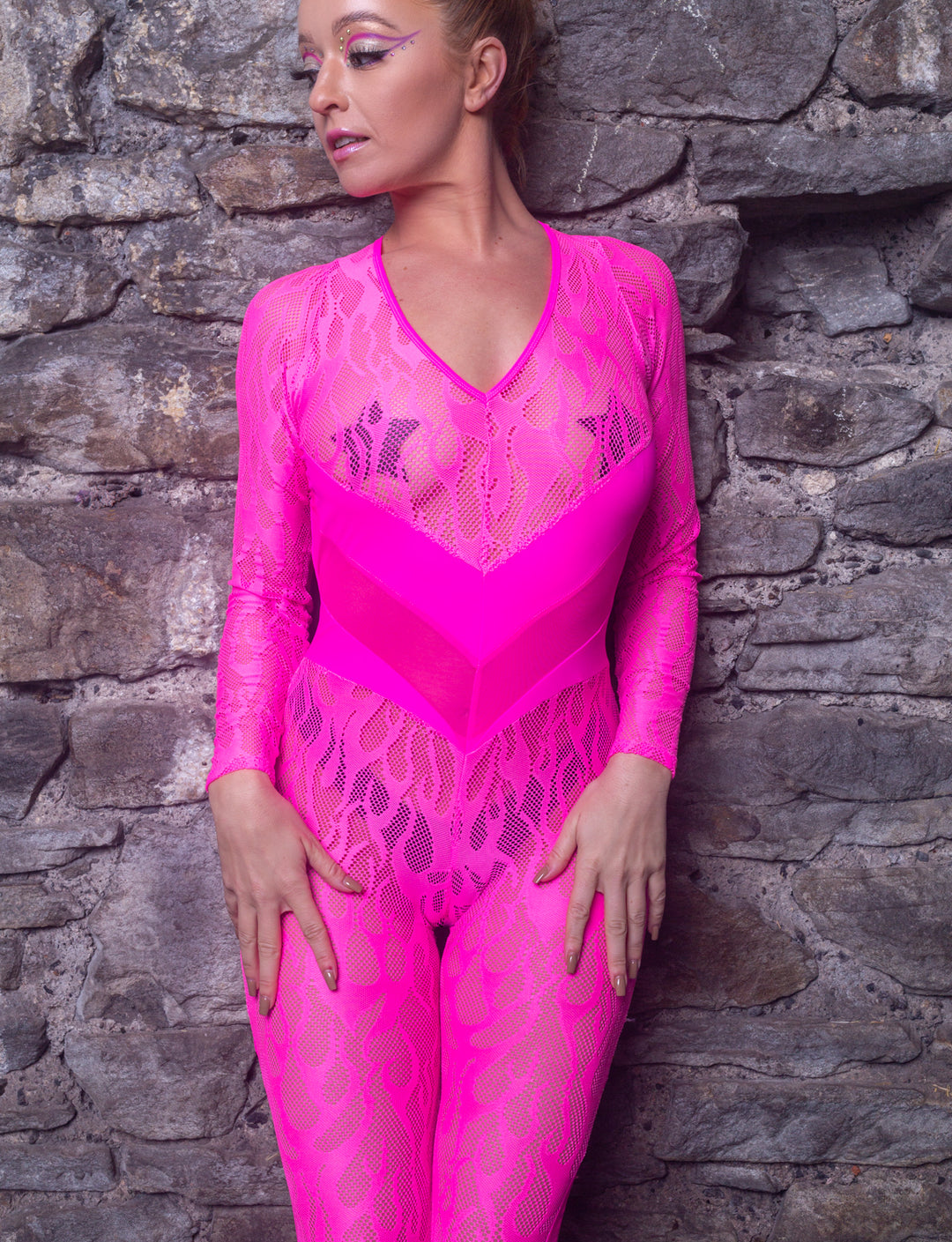 lady wears neon pink flame mesh lace catsuit with sleeves