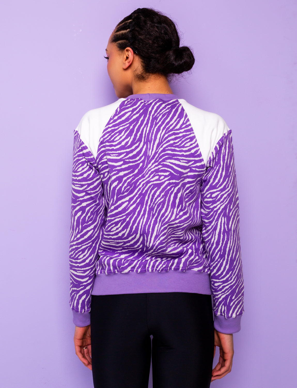 back view of lilac and white zebra print sweatshirt