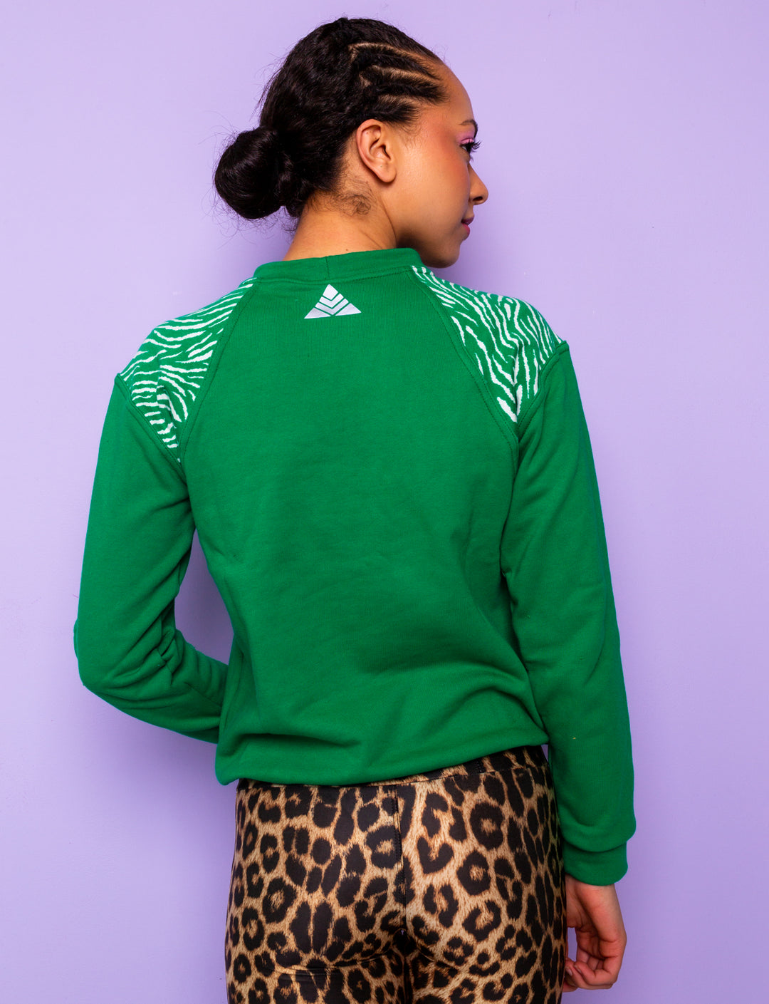 back view of Green sweatshirt with zebra print shoulders
