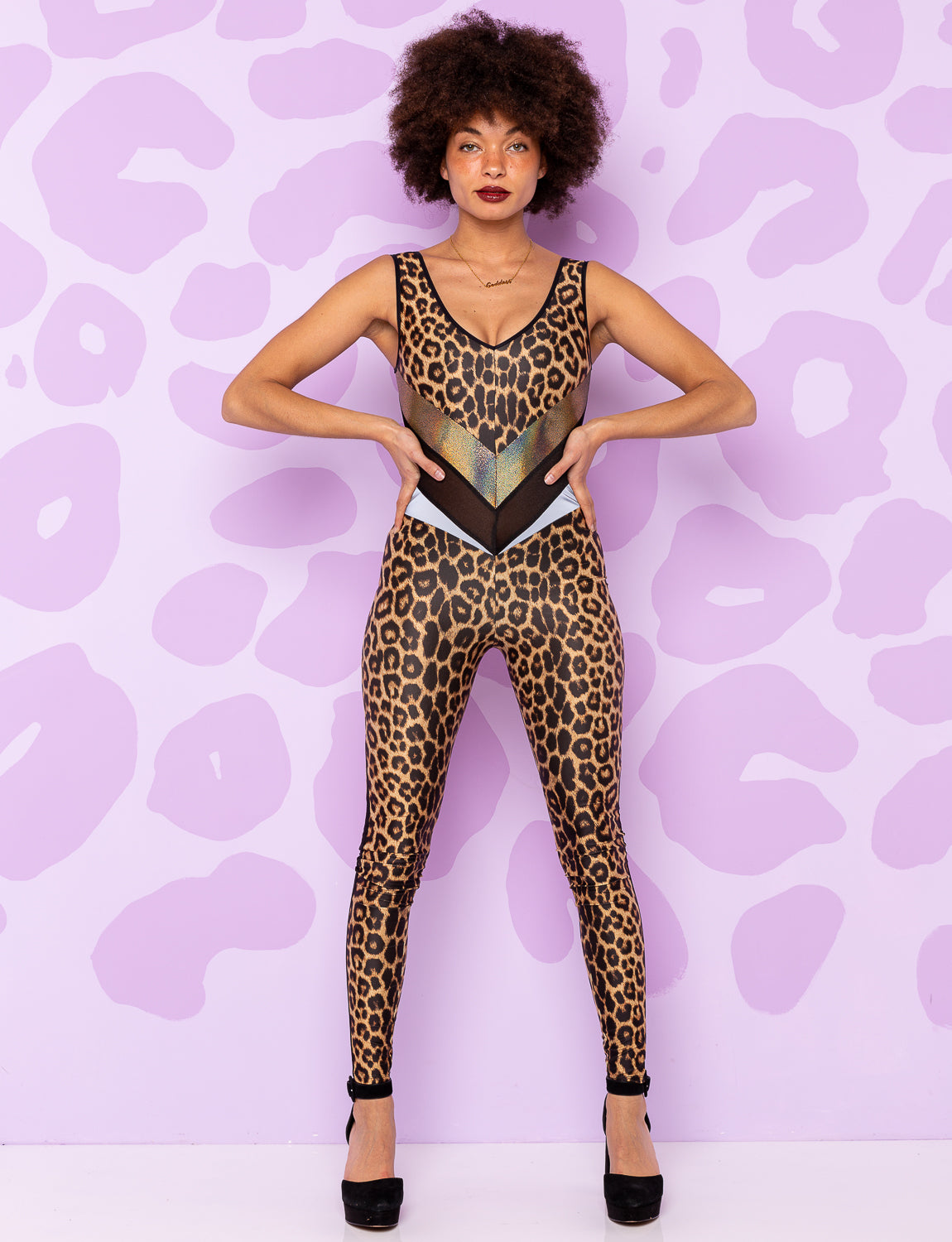 woman wearing a leopard print catsuit