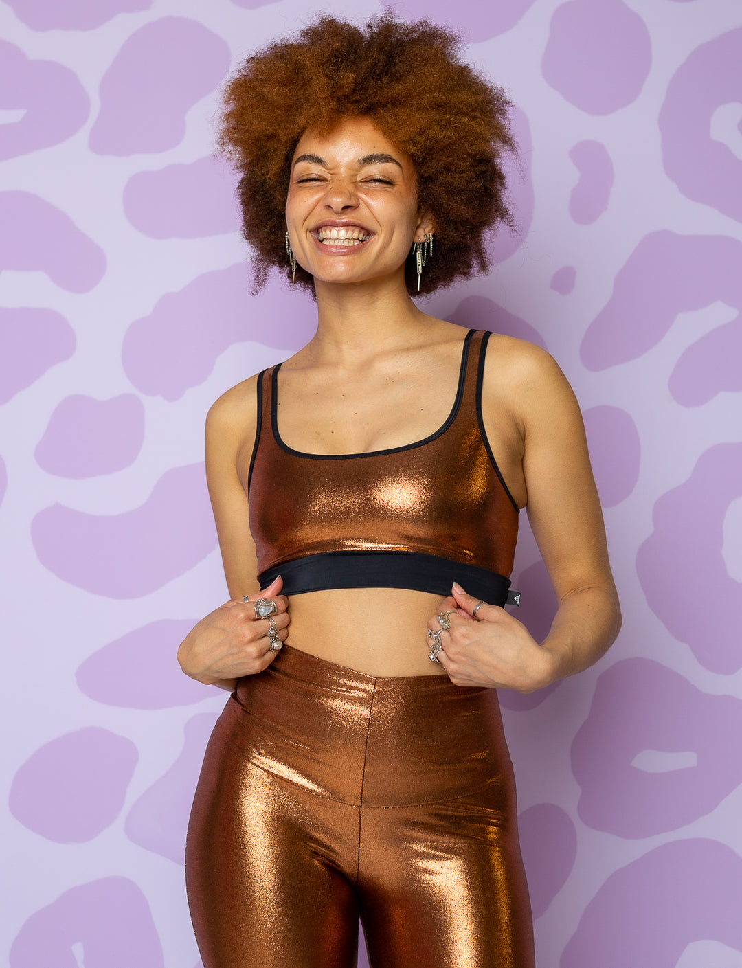 woman wearing copper bralette with black under bust band
