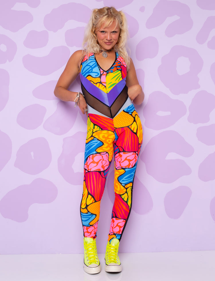 Woman wearing a colourful patterned catsuit by Burnt Soul