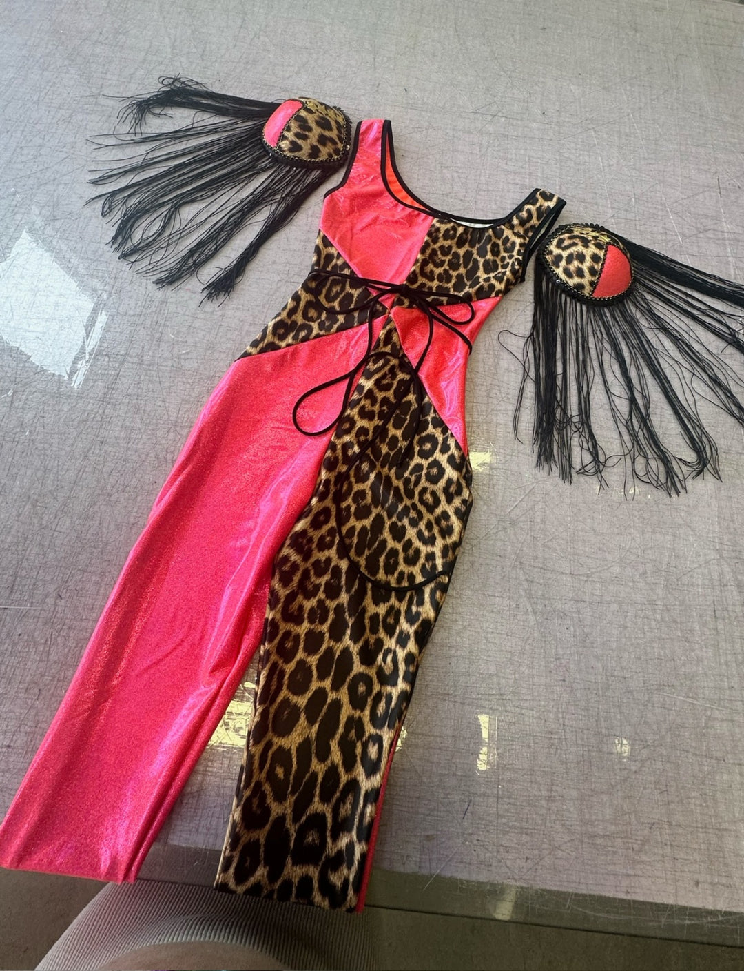 bright pink an leopard print panelled catsuit with matching shoulder pads