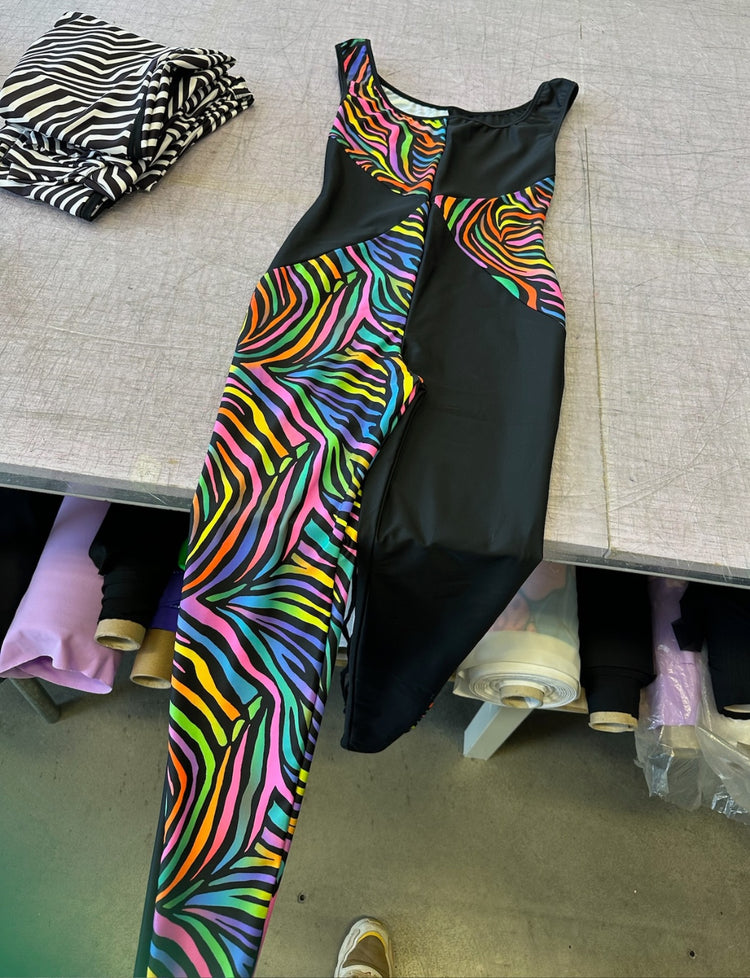 multi coloured zebra print and black panelled lycra catsuit