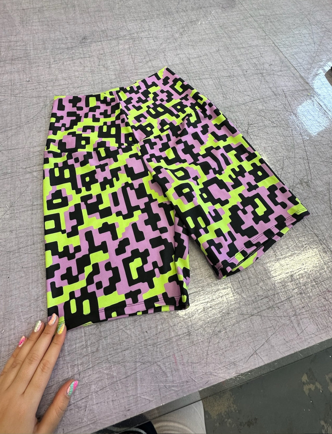 lycra cycling shorts in lime green and lilac gizmo printed lycra