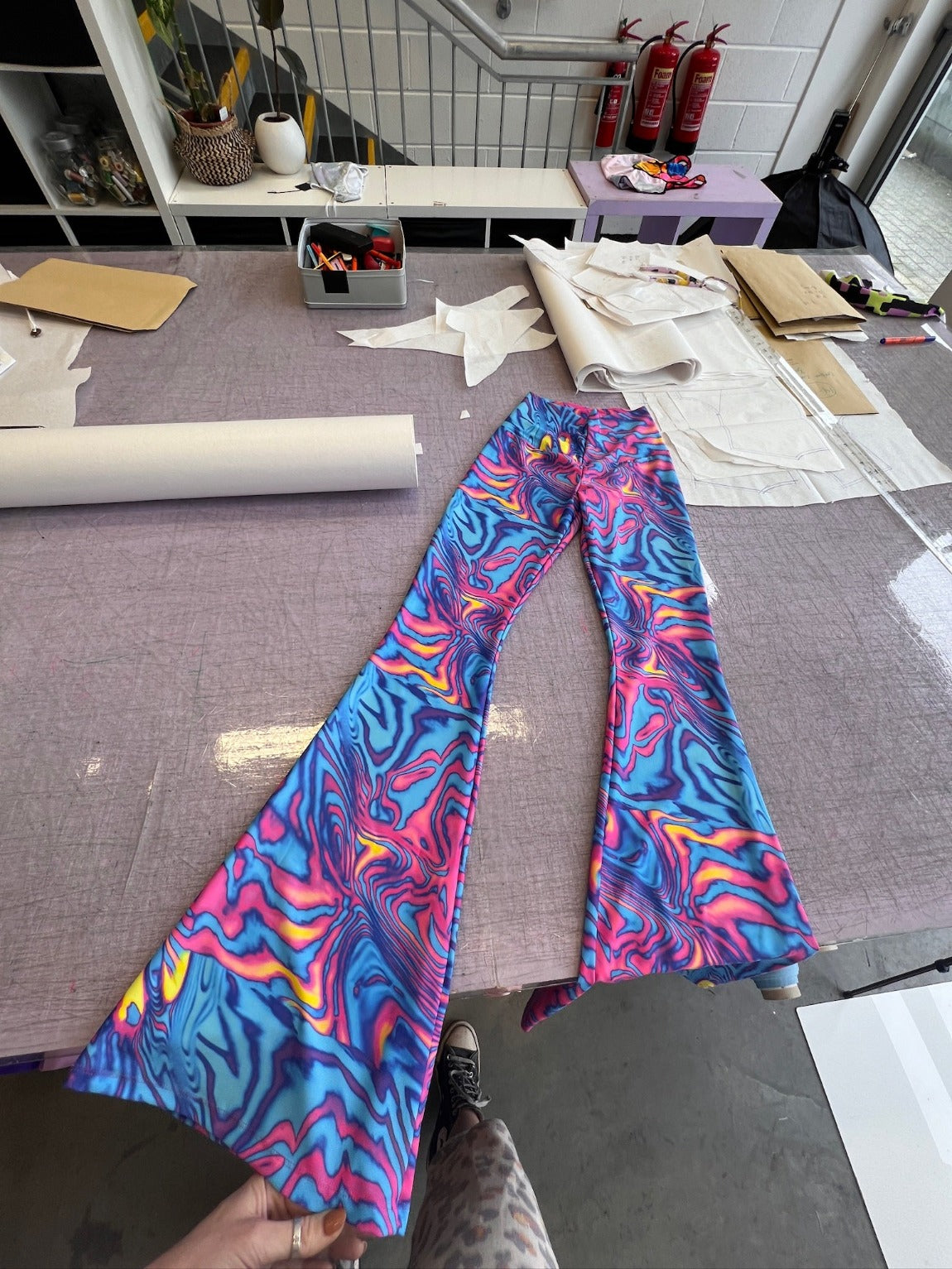 Pink and blue swirly patterned lycra flares.