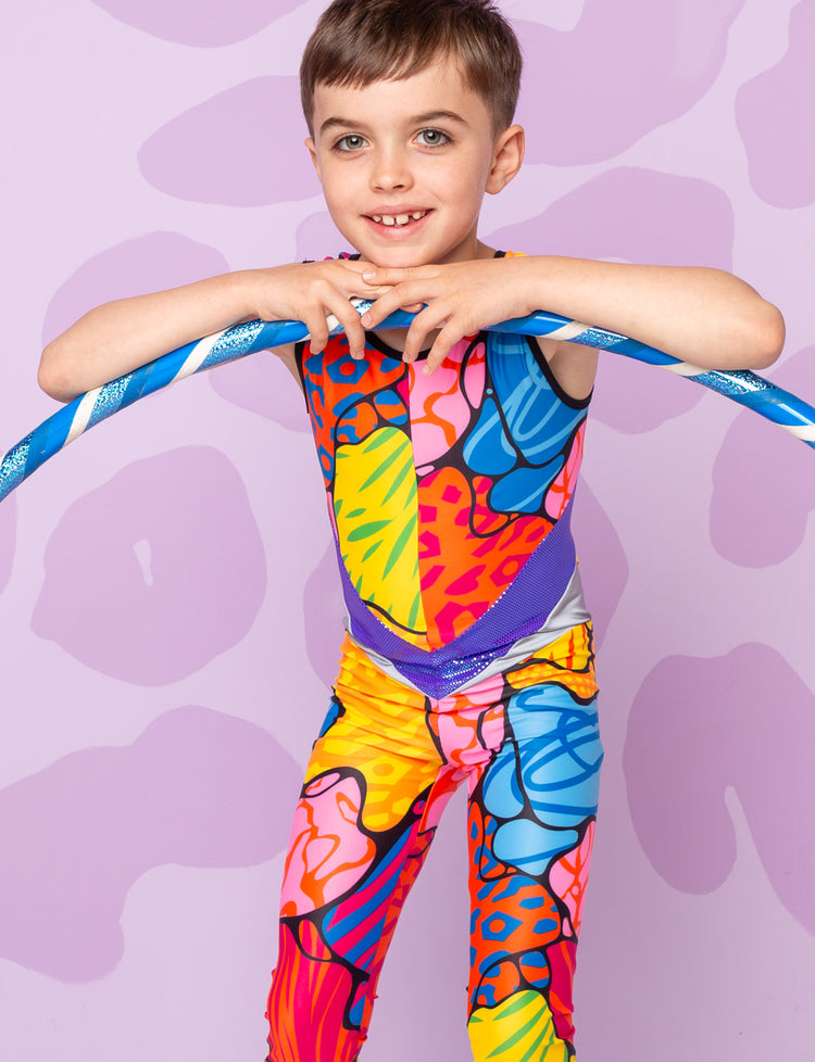 Boy with a hula hoop wearing a patterned catsuit