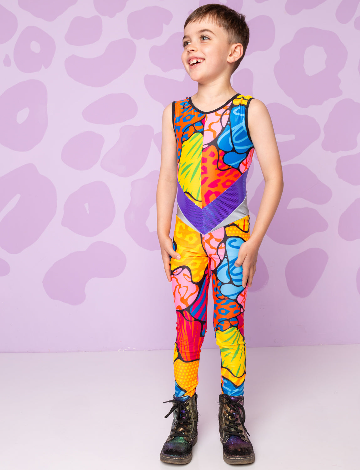 Boy wearing a patterned colourful catsuit