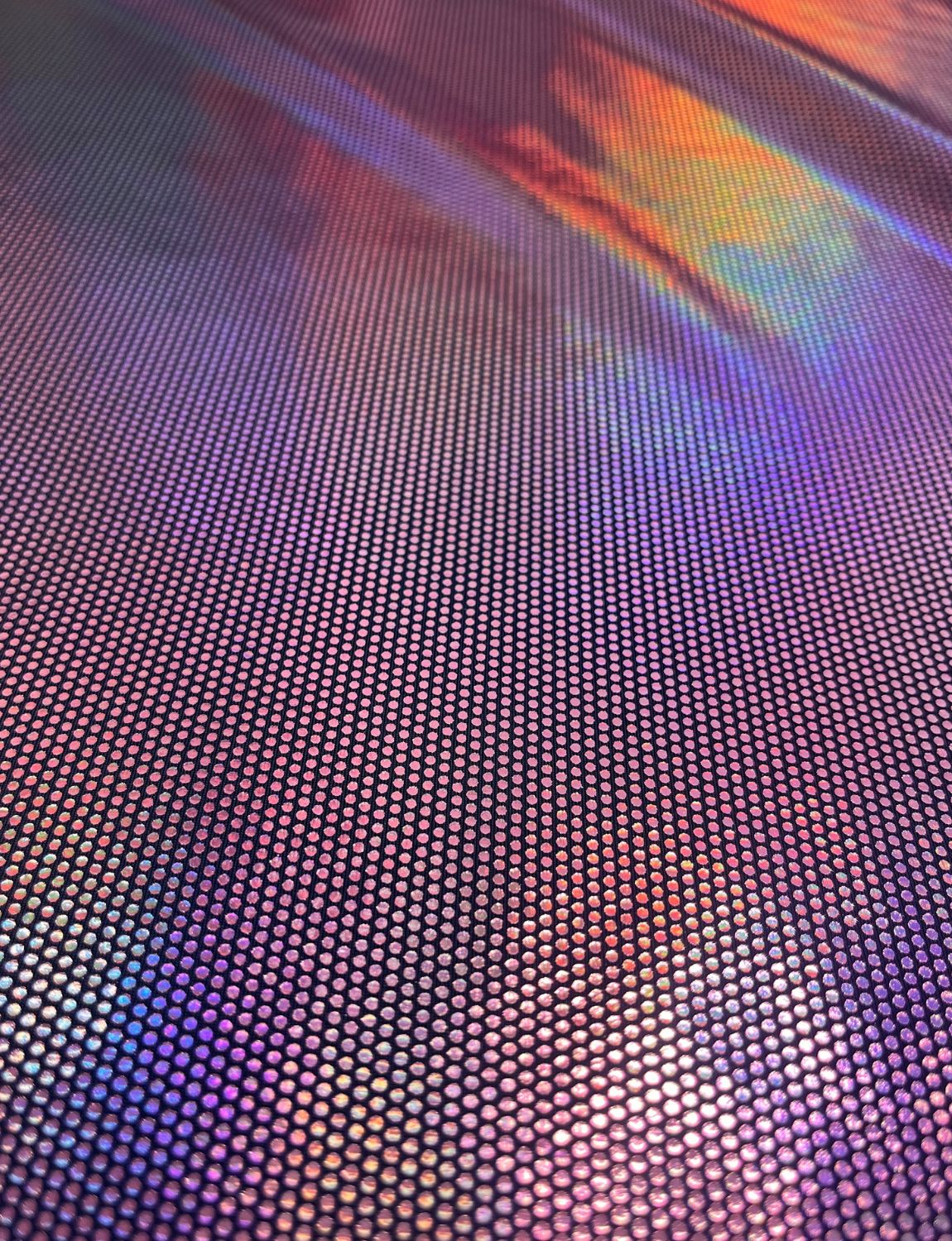 Pink holographic spotted foil on black stretch fabric.