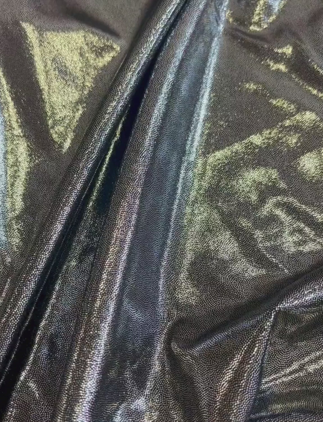 Silver foiled fabric with a black spandex base.