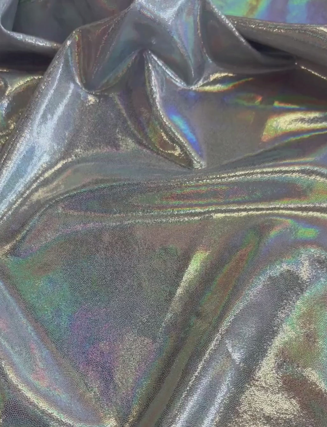 Iridescent silver foil spandex fabric.