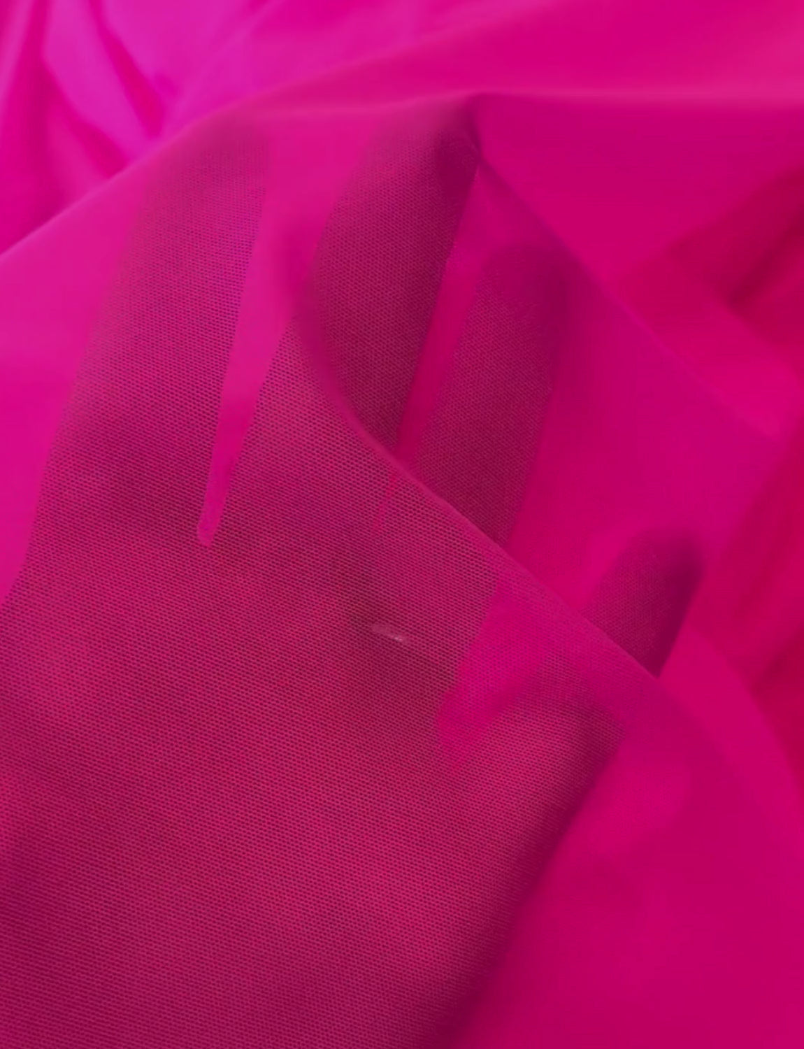 Neon pink mesh stretch fabric.
