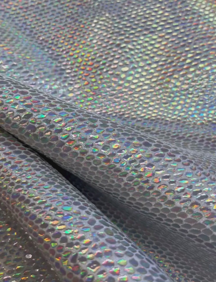 Silver holographic lizard foil print on velvet spandex fabric.