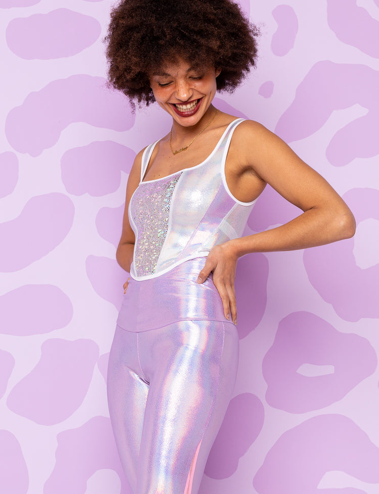 lady modelling a White holographic bodice top with iridescent lilac leggings