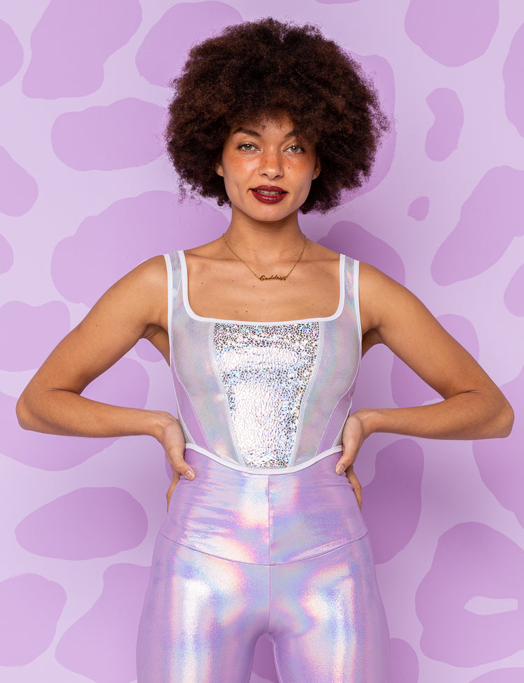 lady modelling a White holographic bodice top with iridescent lilac leggings