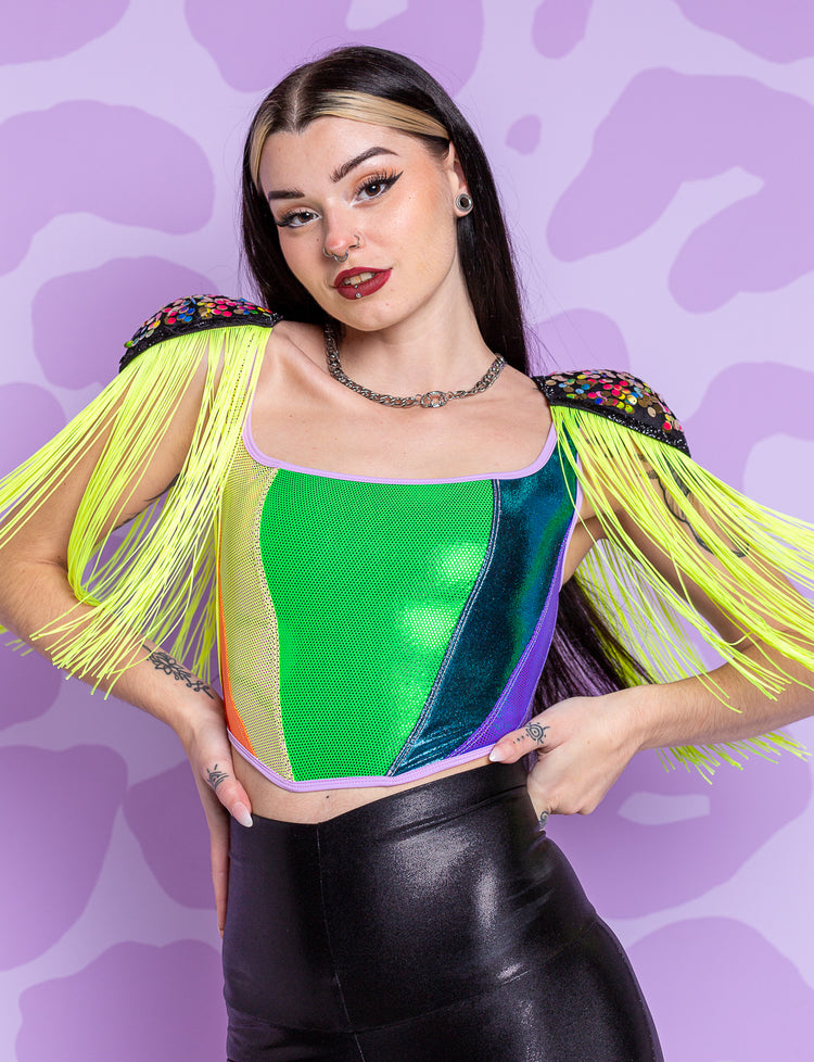 lady modelling rainbow panelled corset bodice top with leopard print flares